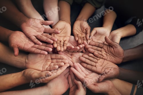 Preview: High angle shot of a group of unrecognizable peoples hands out with their palms open