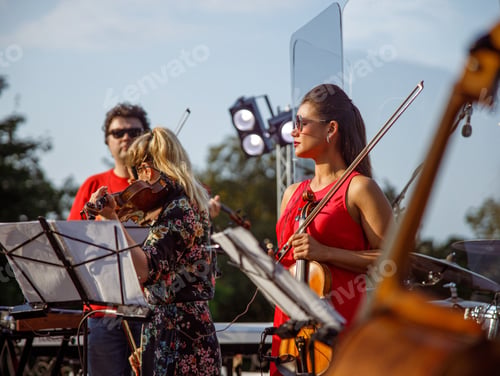 Preview: Orchestra rehearsing before concert on the street