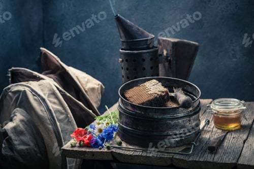 Preview: Hats, fresh honey with honeycombs and beekeeper tools