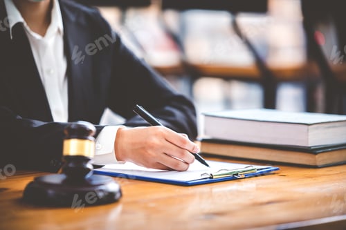 Preview: judge with hammer lawyer justice a businessman in a suit or a lawyer working on paperwork Legal conc