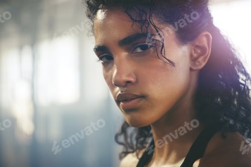 Preview: Unfazed, unbothered, unshakeable. Closeup shot of a focused young sportswoman posing in the gym.