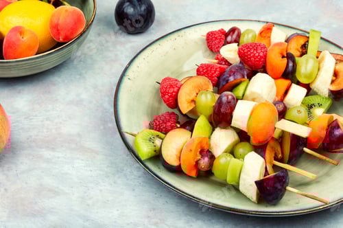 Preview: Colorful Fruit Skewers On A Plate Ready To Eat