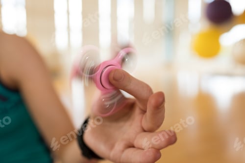 Preview: Girl playing with fidget spinner
