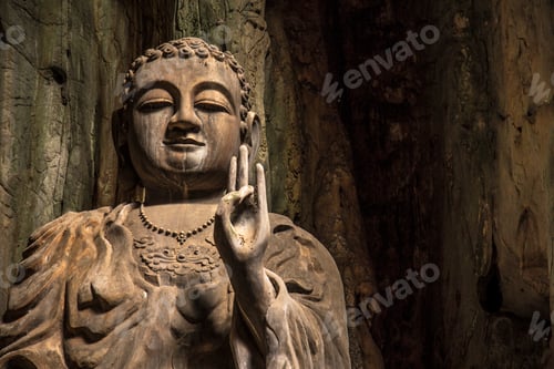 Preview: A Buddha with the peace symbol inside the Marble Mountains of Da Nang