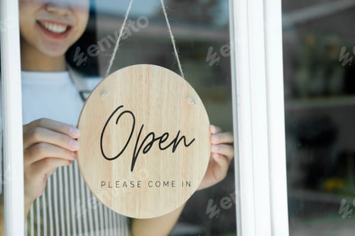 Preview: Close up Young asian business owner open the coffee shop.