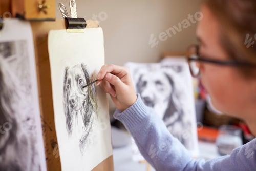 Preview: Side View Of Female Teenage Artist Sitting At Easel Drawing Picture Of Dog
