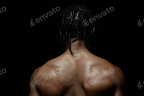 Preview: Back of Black Man Posing Shirtless against Black Backdrop