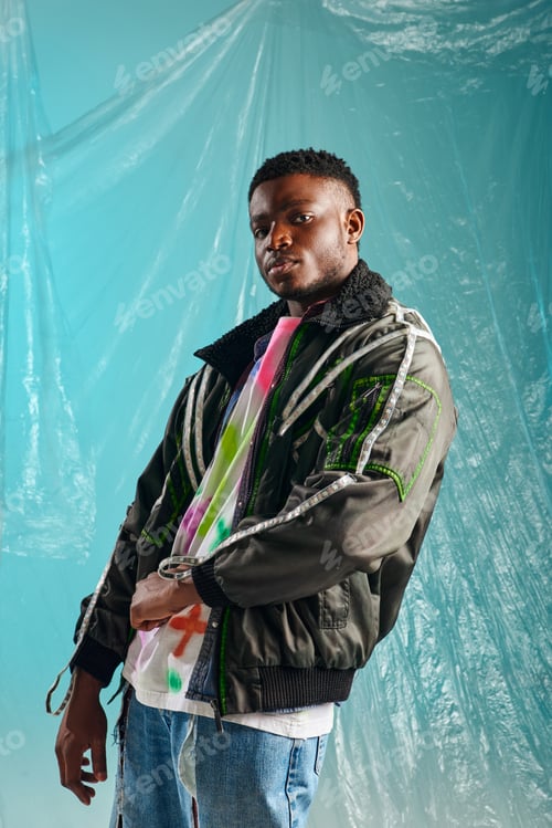 Preview: Good looking afroamerican male model in outwear jacket with led stripes