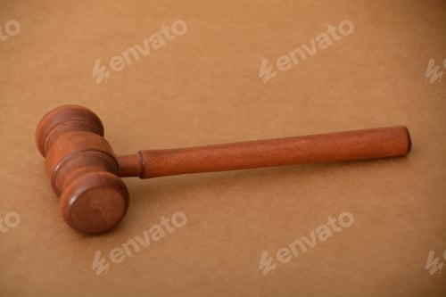 Preview: Brown judge gavel on wooden background. illegal actions by law enforcement