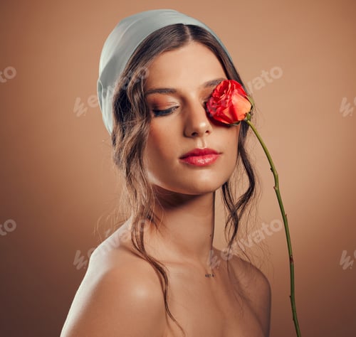 Preview: Flowers, thinking and woman with makeup beauty, floral wellness and creative on a brown studio back