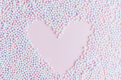 Preview: Heart shape made of pastel multicolored polyfoam balls.