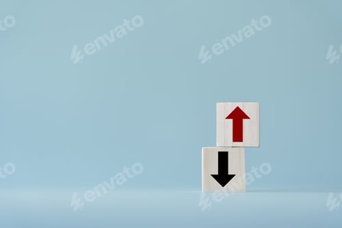 Preview: Up and down turn arrow on wooden blocks difference direction to earn or to loss