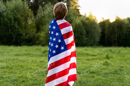 Preview: little boy in nature with the American flag