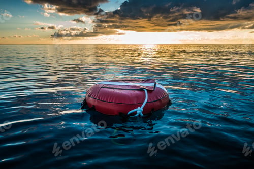 Preview: Red buoy for freediving floating in the ocean.
