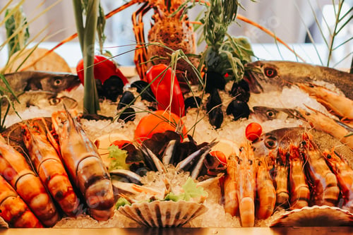 Preview: Fresh seafood ready for cooking. Fish market. Lobster, octopus, shrimp, fish table Food background N