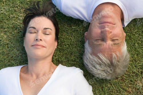 Preview: Couple asleep on the grass