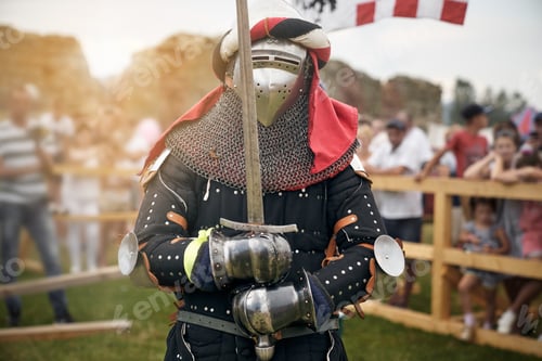 Preview: Man in knight costume holding sword
