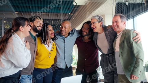 Preview: Startup team celebrating success, hugging and laughing together