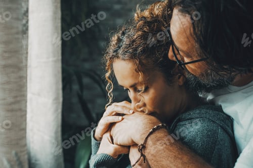 Preview: Couple in love with problems. Romantic man and woman hugging each other and kissing in sad moment