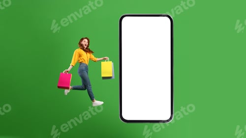 Preview: Excited Shopaholic Woman Jumping To Huge Smartphone Over Green Background