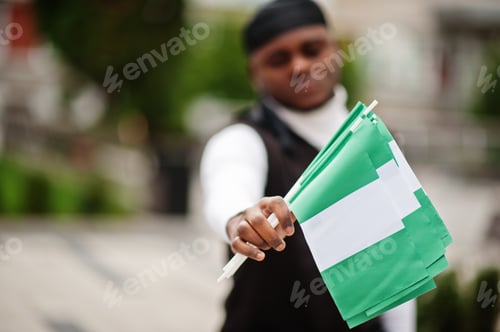 Preview: Young african man hold flag