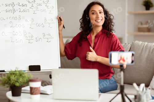 Preview: Lady teacher showing thumb up gesture, explaining math to students