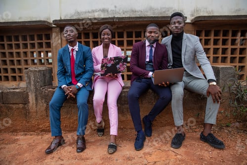 Preview: Group of African business people sitting during a meeting, elegant people working