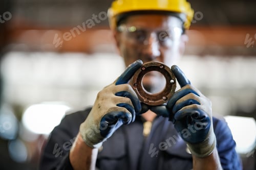 Preview: Industrial factory employee working in metal manufacturing industry