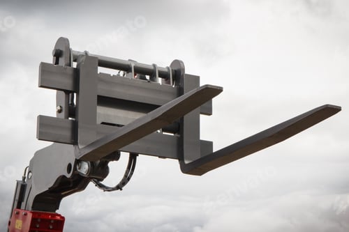 Preview: Part of forklift loader or stacker on sky background. Technology in transport