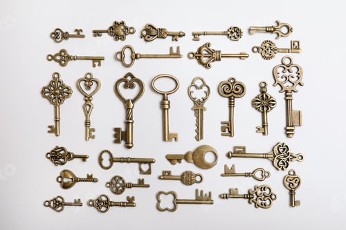 Preview: Bronze vintage ornate keys on white background, top view