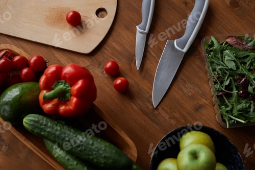 Preview: Background with assorted fresh vegetables on wooden table