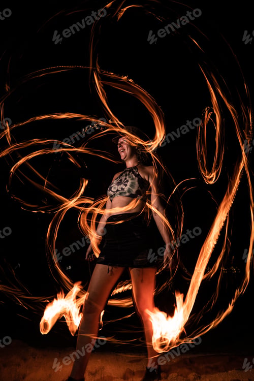 Preview: Female performing a fire show at night