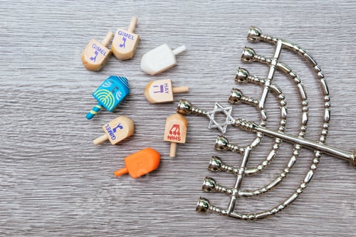 Preview: Menorah on wooden table. Hanukkah holiday symbol.