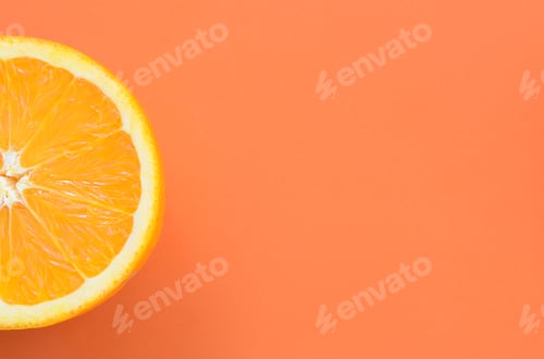 Preview: Top view of a one orange fruit slice on bright background in orange color