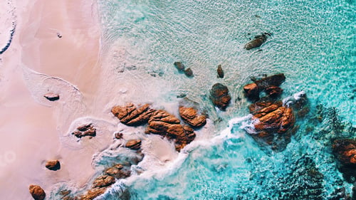 Preview: Aerial view of blue ocean waves and sand