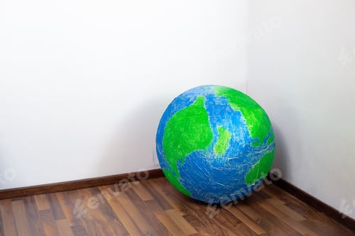 Preview: Eco problem. Planet earth in the corner of the room. Surrealism.