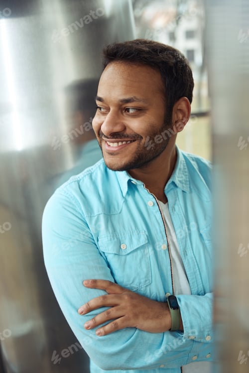 Preview: Portrait of male standing near wall in the office
