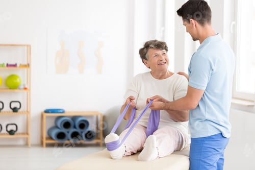Preview: Elderly woman exercising with band
