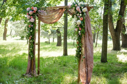 Preview: Beautifully decorated with flowers arch for a wedding ceremony. Wedding decor.