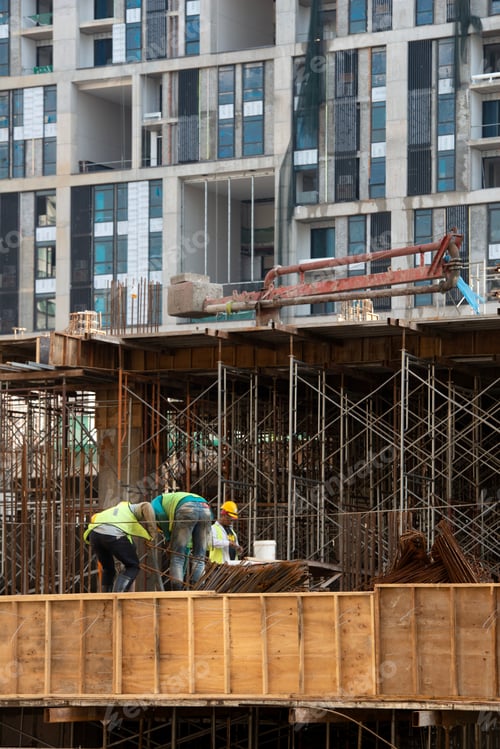 Preview: Construction workers fabricating steel reinforcement bar at the construction site
