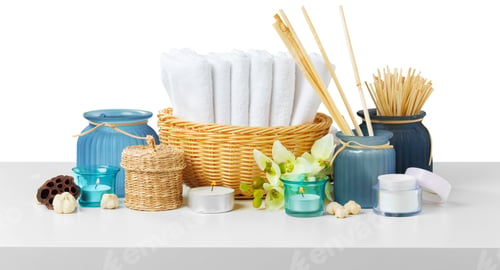 Preview: Items on a table for a wellness or spa setup with towels, candles, and decorations