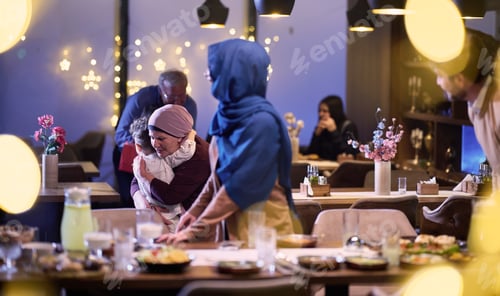 Preview: Grandparents arrive at their children's and grandchildren's gathering for iftar in a restaurant
