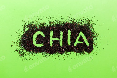 Preview: chia word made from chia seeds top view on colored background. Healthy superfood