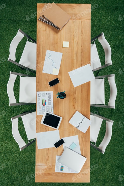 Preview: Top view of table with digital tablet, smartphones and documents in modern office