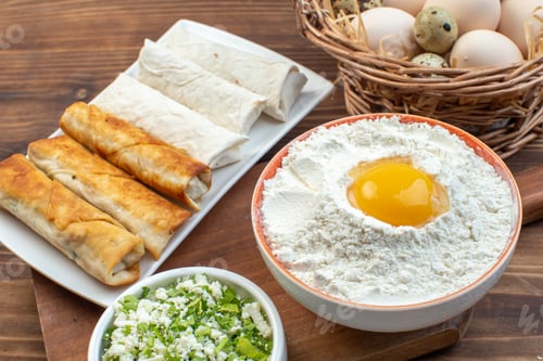 Preview: front view greens pita rolls with pastries and eggs on brown background cooking food bake pastry