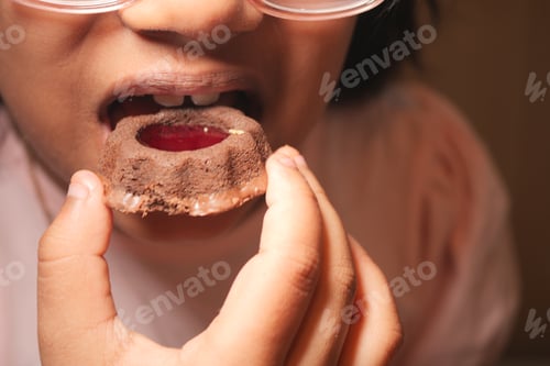 Preview: Child enjoys a colorful dessert at home in the afternoon
