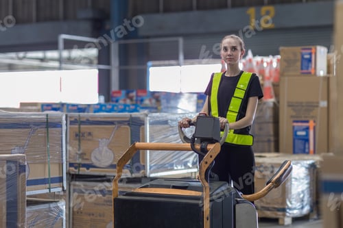 Preview: Woman worker at forklift driver happy working in industry factory logistic ship.
