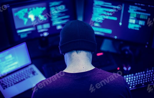 Preview: Rear view of man working on computer coding program