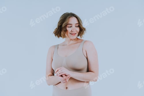 Preview: Image of a beautiful woman posing in studio. Concept about body positivity and self acceptance