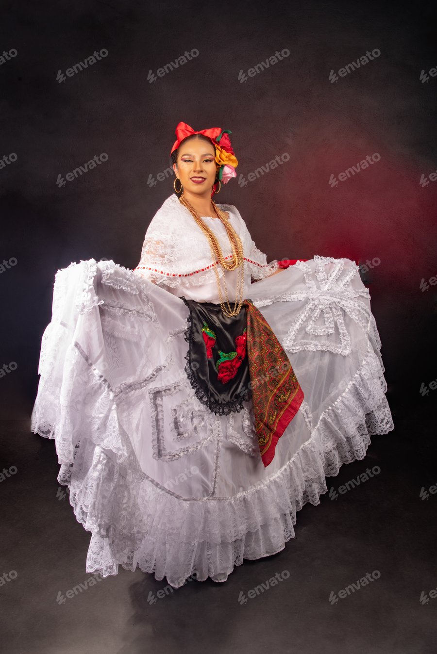 Cover for A woman in a white dress with a red flower in her hair